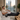 Person using compression recovery boots while relaxing at home