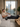 Person using compression recovery boots while relaxing at home