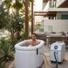 Person using an ice bath at home in Dubai with recovery chiller