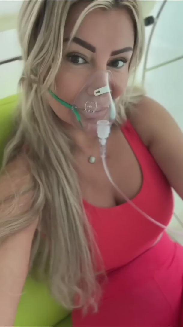 Person using a hyperbaric oxygen chamber at home