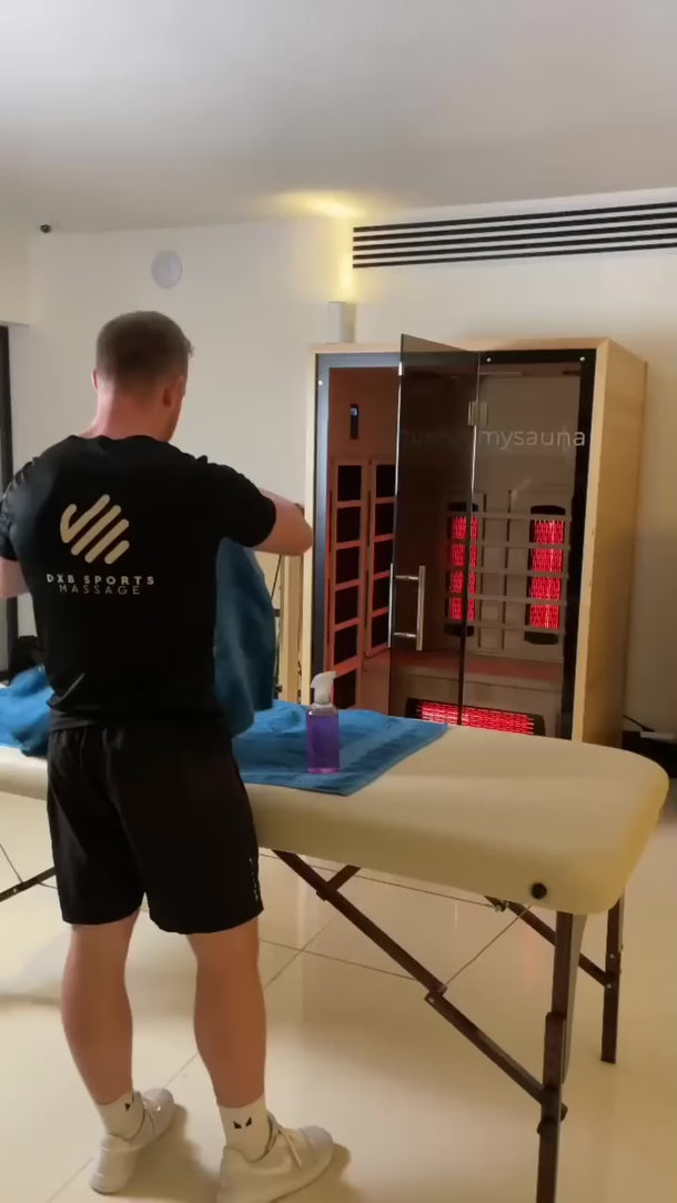 Person relaxing inside a Full Spectrum Infrared Sauna at home