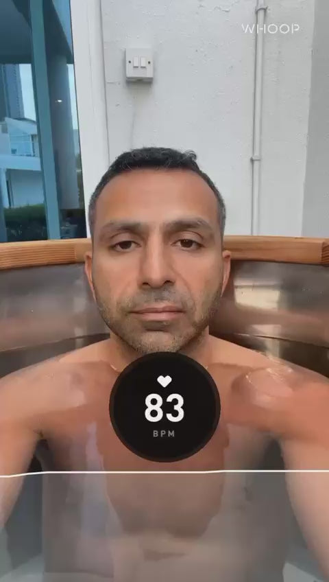 Athlete using an Ice Barrel after training to support recovery